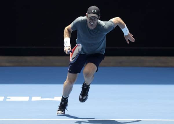 STRUGGLING: Andy Murray runs to make a return to Serbia's Novak Djokovic during a practice match on Margaret Court Arena Picture: AP/Mark Baker