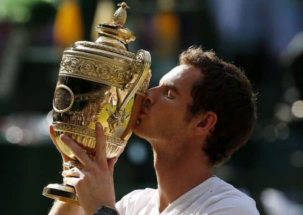 Andy Murray celebrates his 2013 Wimbeldon win.