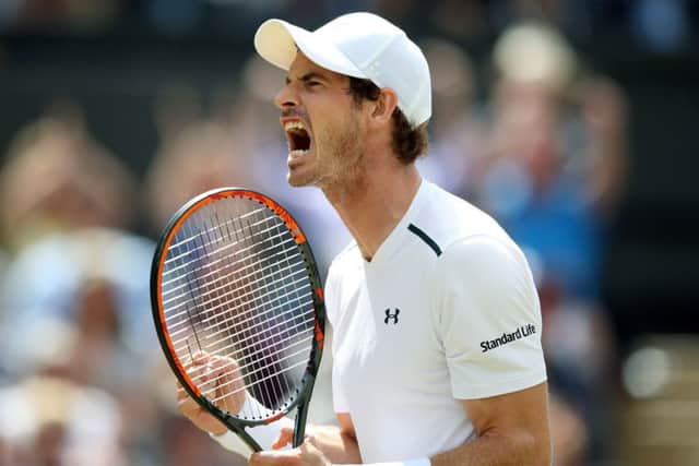Andy Murray lets out a triumphant roar after winning a match at Wimbledon in 2017. (Picture: PA)