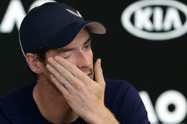 Britain's Andy Murray wipes tears from his face during a press conference (AP Photo/Mark Baker)