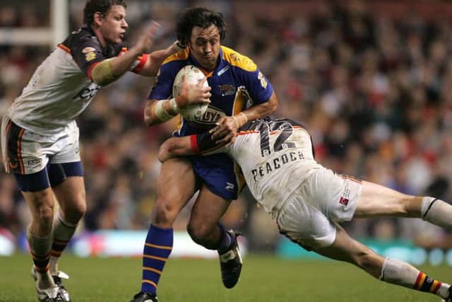 Willie Poching takes on Bradford Bulls' Jamie Peacock and Lee Radford in Leeds Rhinos' 2004 Grand Final win at Old Trafford. (SWPix)