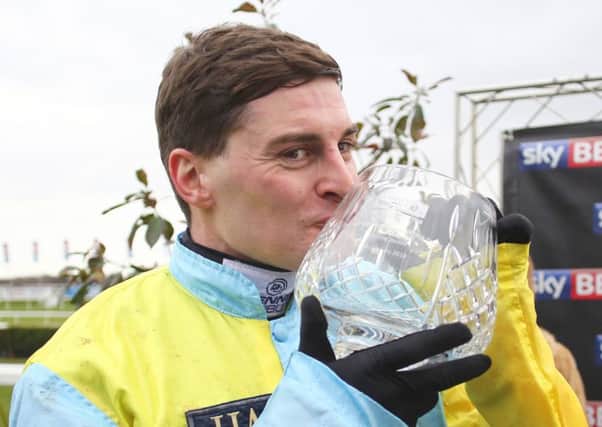 Henry Brooke pictured with the  Sky Bet Chase trophy  at Doncaster.