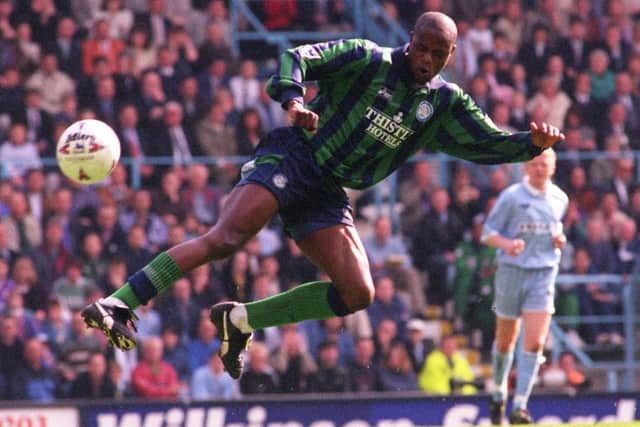 Leeds United's Phil Masinga tries a mid air kick at Coventry goal but keeper Steve Ogrizovic punches it away.