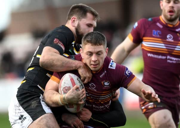 Yorkshire Cup semi final.Batley's Alistair Leak is tackled by York's Jason Bass and William Jubb. (
Picture: Jonathan Gawthorpe
)