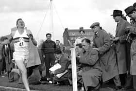 In this May 6, 1954 file photo, Britain's Roger Bannister hits the tape to become the first person to break the four-minute mile in Oxford, England. A statement released Sunday March 4, 2018, on behalf of Bannister's family said Sir Roger Bannister died peacefully in Oxford on March 3, aged 88. (AP Photo, File)