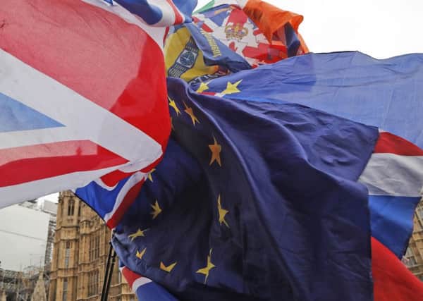 Flags fly outside Parliament as MPs prepare to vote on Theresa May's Brexit deal.