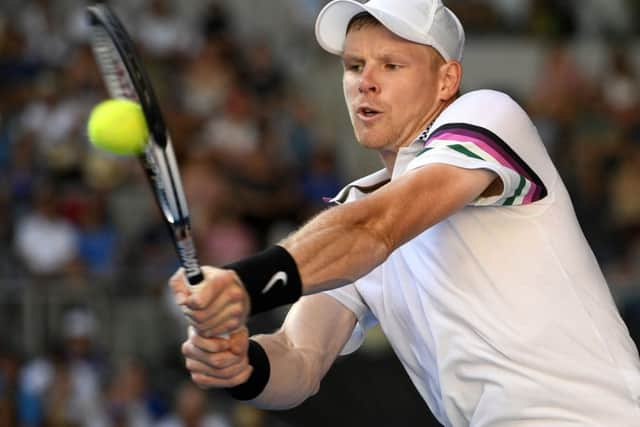 Britain's Kyle Edmund makes a backhand return to Tomas Berdych of the Czech Republic during their first round match at the Australian Open. (AP Photo/Andy Brownbill)