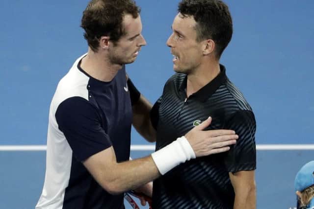 Britain's Andy Murray, left, congratulates Spain's Roberto Bautista Agut after their first round match at the Australian Open tennis championships in Melbourne. (AP Photo/Mark Schiefelbein)