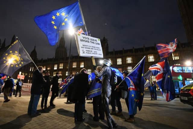 Protesters outside the Houses of Parliament, London as Prime Minister Theresa May has issued a last-ditch plea for MPs to back her Brexit deal, after Brussels chiefs issued a letter offering assurances that they do not want the controversial "backstop" to be permanent.