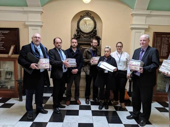 Teachers at The Grove Academy handed a petition with 5,500 signatures to Councillor Patrick Mulligan, North Yorkshire's Executive Member for Education.
