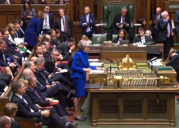 Theresa May addresses MPs during the no confidence debate.