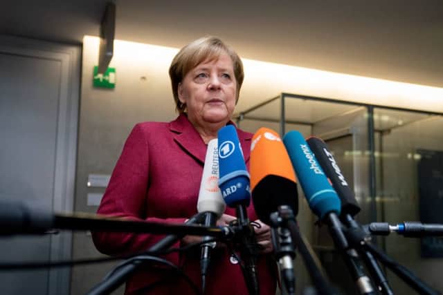 German Chancellor Angela Merkel answers journalists' questions on the sidelines of a session of the Committee of Foreign Affairs of the Bundestag (lower house of parliament) on January 16, 2019 in Berlin. - Merkel said "we still have time to negotiate" after the British parliament overwhelmingly rejected Prime Minister's deal on leaving the European Union. (Photo by Kay Nietfeld / dpa / AFP) / Germany OUT        (Photo credit should read KAY NIETFELD/AFP/Getty Images)