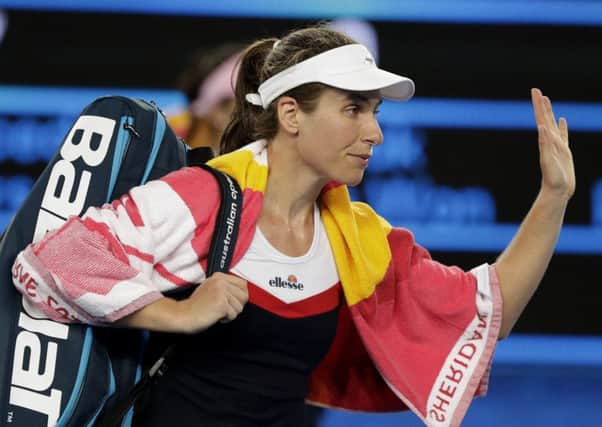 Britain's Johanna Konta waves as she leaves the court following her second round loss to Spain's Garbine Muguruza. Picture: AP/Mark Baker