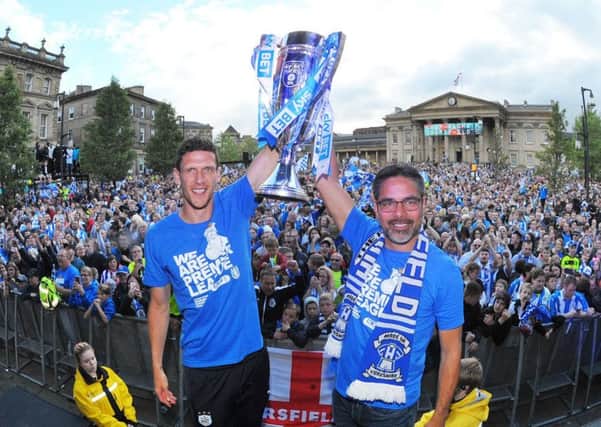 HAPPY DAYS:  Mark Hudson and manager David Wagner celebrate Huddersfield Town's promotion in the town centre.