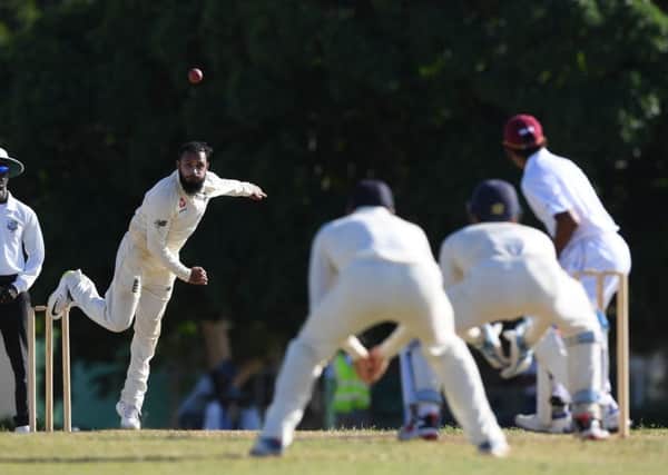 TOILING AWAY: Yorkshire's Adil Rashid bowls during day two of the match between a West Indies Board XI and England in Bridgetown. Picture: Shaun Botterill/Getty Images.