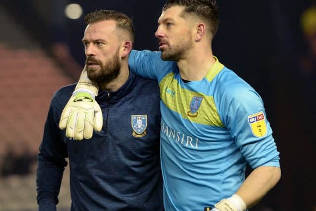 Steven Fletcher and Keiren Westwood embrace after Sheffield Wednesday's victory over Wigan.