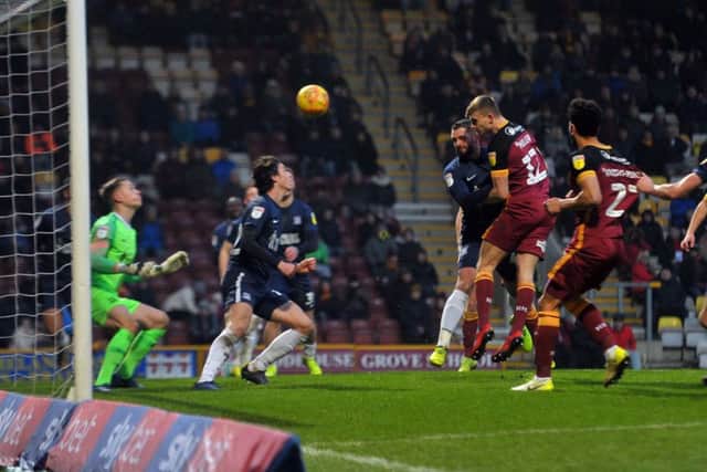 Bradford City's George Miller powers a header which Southend United goalkeeper Nathan Bishop saves superbly. Picture: Tony Johnson.