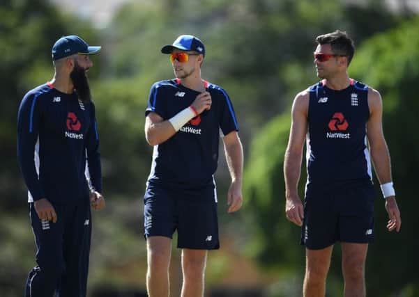 England fast bowler James Anderson, right, with captain Joe Root, centre, and Moeen Ali (Picture: Shaun Botterill/Getty Images).