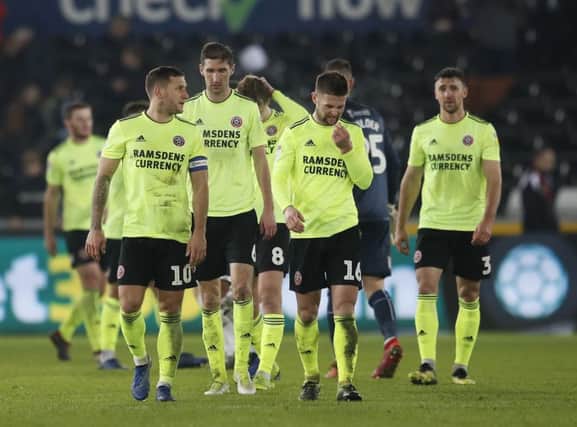 Sheffield United players leave the field after losing at Swansea City on Saturday evening (Picture: : Simon Bellis/Sportimage).