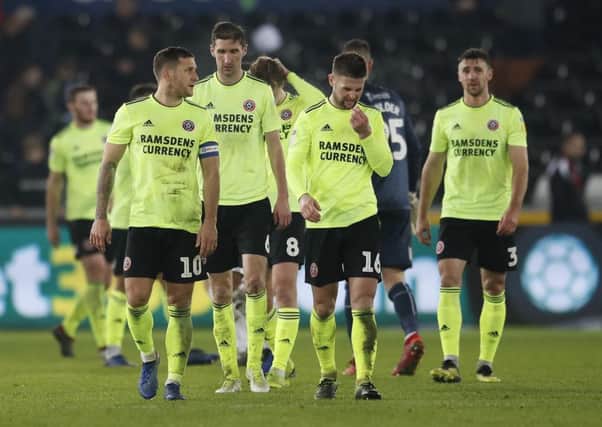 Sheffield United players leave the field after losing at Swansea City on Saturday evening (Picture: Simon Bellis/Sportimage).
