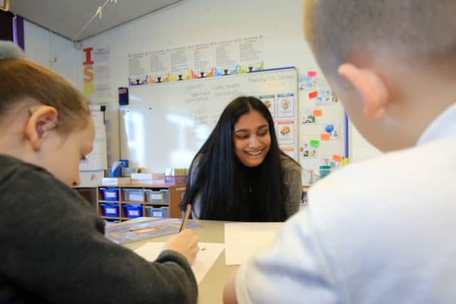 Primary school pupils from Arbourthorne Primary School are being taught Latin to help improve literacy standards. The initiative is being supported by Classics teachers and students from Sheffield High School for Girls. Pictured in one of the lessons is Sneha Shiralagi from Sheffield High School for Girls. Picture: Chris Etchells