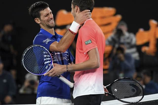 Serbia's Novak Djokovic is congratulated by Russia's Daniil Medvedev, right, after winning their fourth round match at the Australian Open tennis championships in Melbourne. (AP Photo/Andy Brownbill)