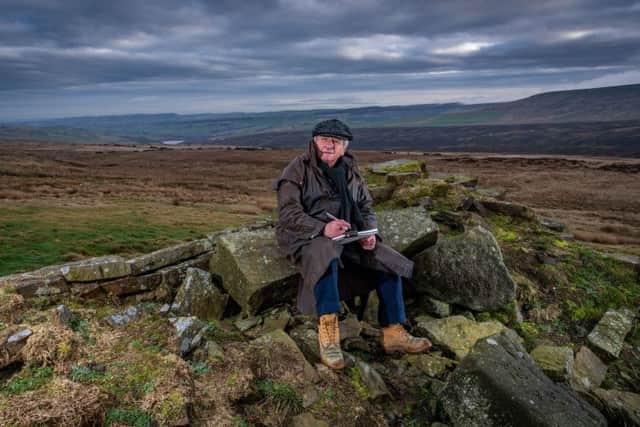 Ashley Jackson pictured working on moorland high above Holmfirth.  PIC: James Hardisty