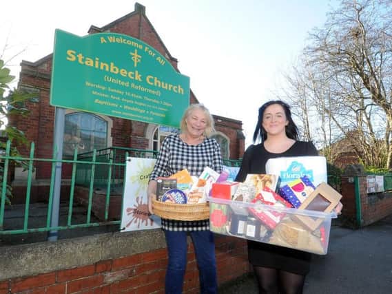 Maureen Lillywhite and volunteer Katie Nicholson with donated household items put from the reverse advent campaign.
