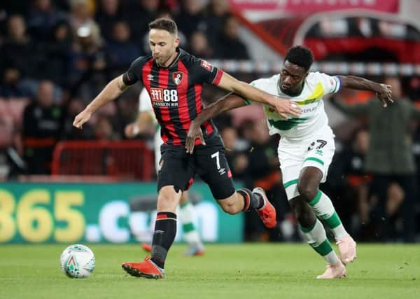 Marc Pugh, left, seen in action for Bournemouth against Norwich City in the League Cup last October (Picture: Adam Davy/PA Wire).