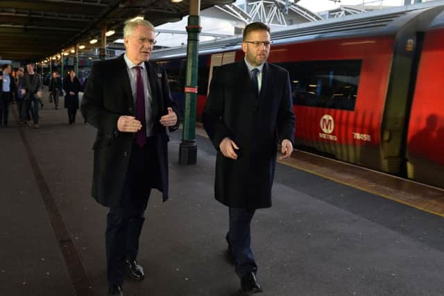 Rail Minister Andrew Jones with Richard Allan, Northern's deputy managing director.