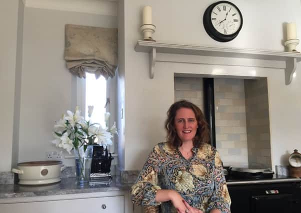 Eleanor Goddard in her kitchen by her beloved Aga.