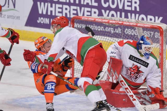 Sheffield Steelers' Tom Zanoski gets cleared from in front of the Cardiff Devils' net. Picture: Dean Woolley.