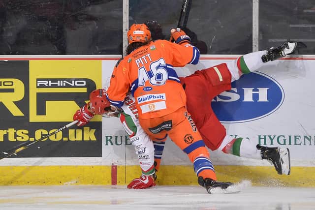 TAKE THAT: Sheffield Steelers' Josh Pitt puts a hit on a Cardiff opponent at Sheffield Arena on Wednesday night. Picture: Dean Woolley.