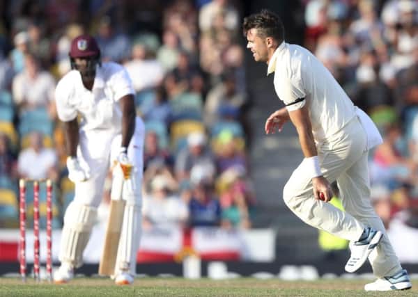 England's James Anderson takes the catch from his own bowling to dismiss West Indies' captain Jason Holder.