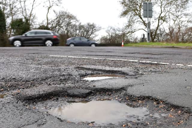 How can maintenance of potholes be improved?