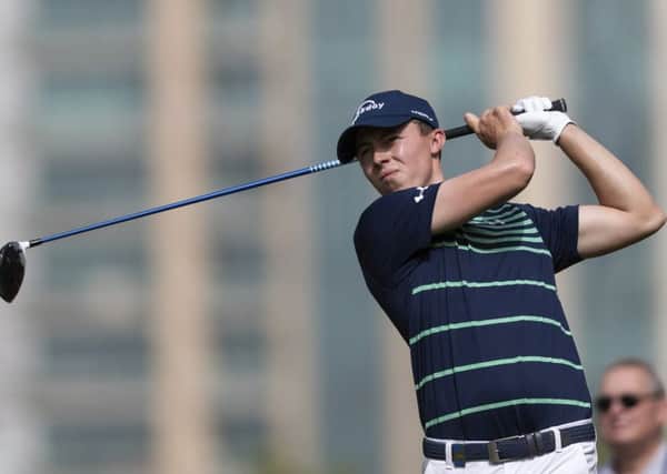 Matthew Fitzpatrick of England tees off on the 5th hole during round one of the Dubai Desert Classic golf tournament, in Dubai, United Arab Emirates. (AP Photo/Neville Hopwood)