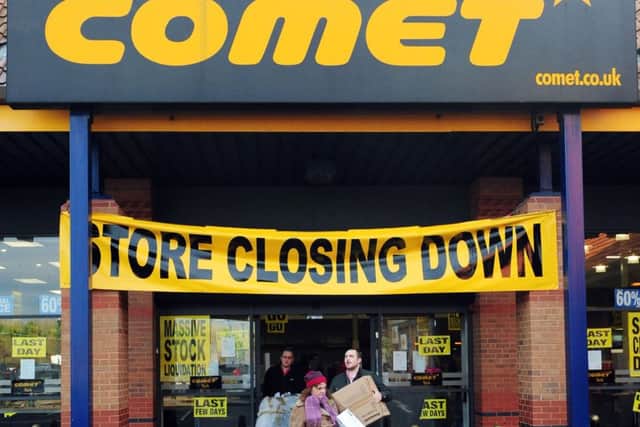 People leave a Comet store in York on its final day of trading.