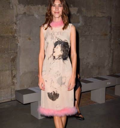 Alexa Chung wore it first. Striking print and fine feathers at the Christopher Kane Spring/Summer 2019 London Fashion Week show at Tate Modern, London.  PA Wire
