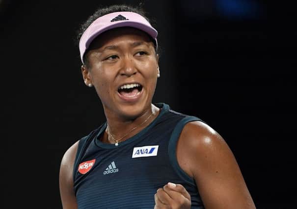 Japan's Naomi Osaka reacts after winning the first set against Karolina Pliskova of the Czech Republic during their semifinal at the Australian Open tennis championships in Melbourne. (AP Photo/Andy Brownbill)