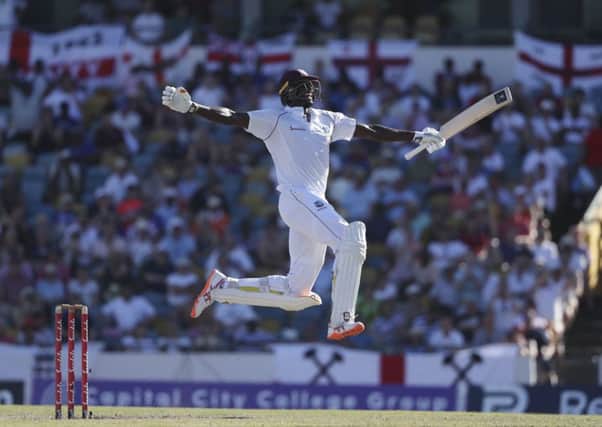 West Indies' captain Jason Holder celebrates after scoring a double century against England.