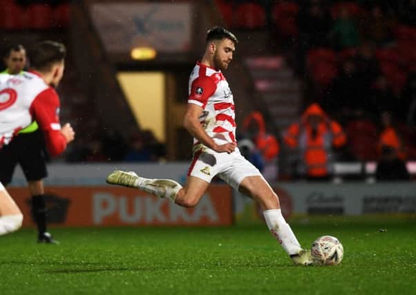Doncaster's Ben Whiteman scores the winner from the spot. Picture Jonathan Gawthorpe