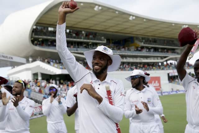 West Indies' Roston Chase celebrates taking eight wicket against England at the Kensington Oval in Bridgetown. Picture: AP/Ricardo Mazalan