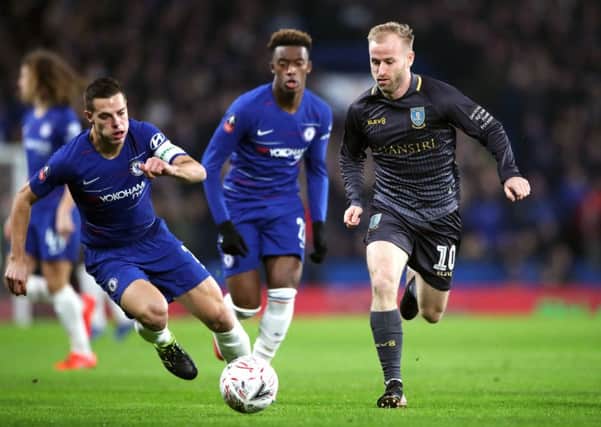 Sheffield Wednesday's Barry Bannan (right) and Chelsea's Cesar Azpilicueta (left) battle for the ball at Stamford Bridge. Picture: Nick Potts/PA