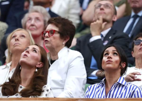 The Duchess of Cambridhe (left) and the Duchess of Sussex at Wimbledon last year.