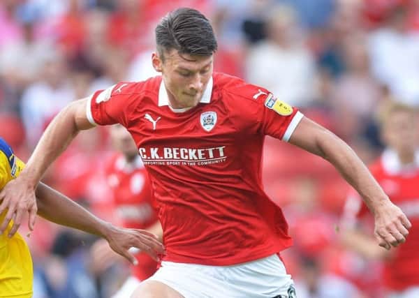 Kieffer Moore's goal earned Barnsley a 2-2 draw at Oxford United on Tuesday night.