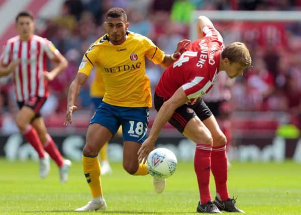 New Huddersfield Town signing Karlan Grant, left, in action for Charlton Athletic.