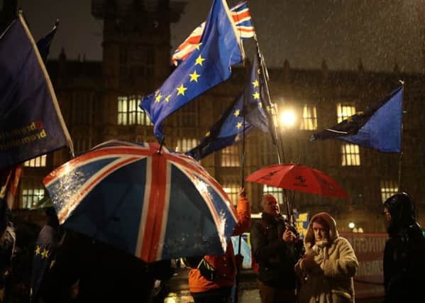 Pro-EU and pro-Brexit supporters outside the Houses of Parliament.