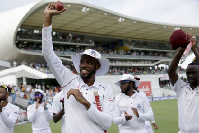 West Indies' Roston Chase celebrates taking eight wicket against England during day four of the first cricket Test match at the Kensington Oval in Bridgetown. (AP Photo/Ricardo Mazalan)