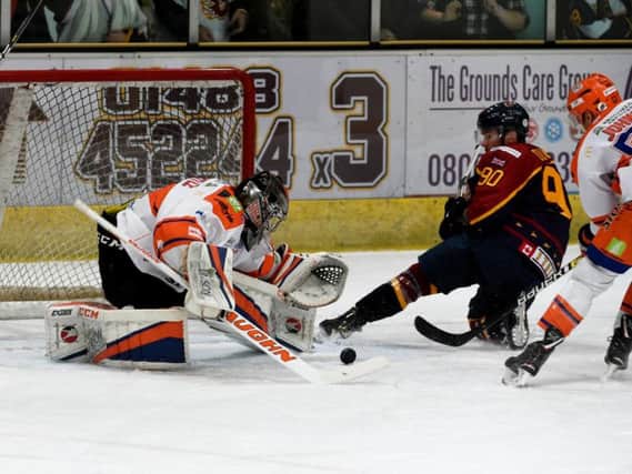 MAIN MAN: Jackson Whistle gets down low to keep out the Guildford Flames. Picture: John Uwins/EIHL.