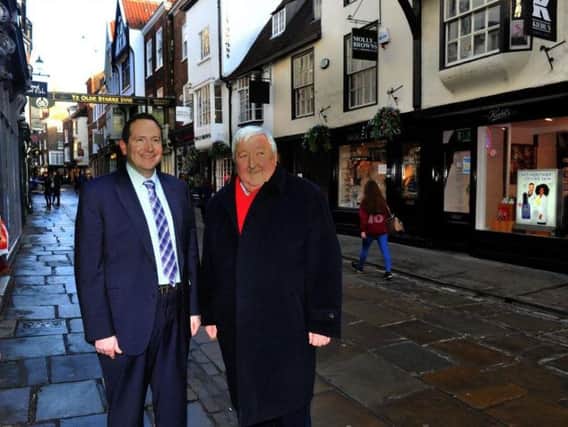 Councillor Keith Aspden (left) and Coun Ian Gillies, leader of York City Council, pictured in Stonegate in York city centre. Footfall in the city centre grew last year to buck the national trend. Picture by Gary Longbottom.